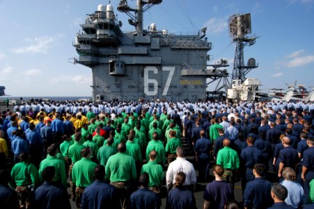 US Navy 041124-N-8704K-003 Sailors aboard the conventionally powered aircraft carrier USS John F. Kennedy (CV 67) stand in ranks during a frocking ceremony for 360 crew members