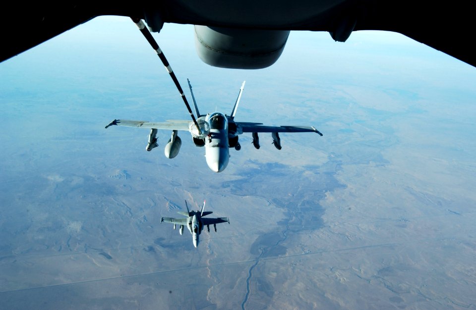 US Navy 041126-F-3188G-141 A pair of F-A-18C Hornets receives fuel from a U.S. Air Force KC-10 Extender