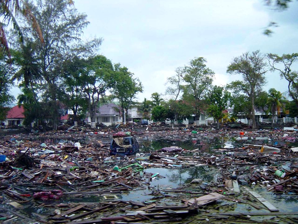 US Navy 050101-O-XXXXB-017 Trash and debris line the streets near local homes in downtown Banda Aceh, Sumatra, following a massive Tsunami that struck the area on Dec. 26, 2004