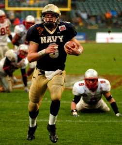US Navy 041230-N-9693M-167 U.S. Naval Academy Midshipman 1st Class Aaron Polanco runs for a touchdown in the 3rd quarter of play against the Lobos of New Mexico at the Emerald Bowl in San Francisco