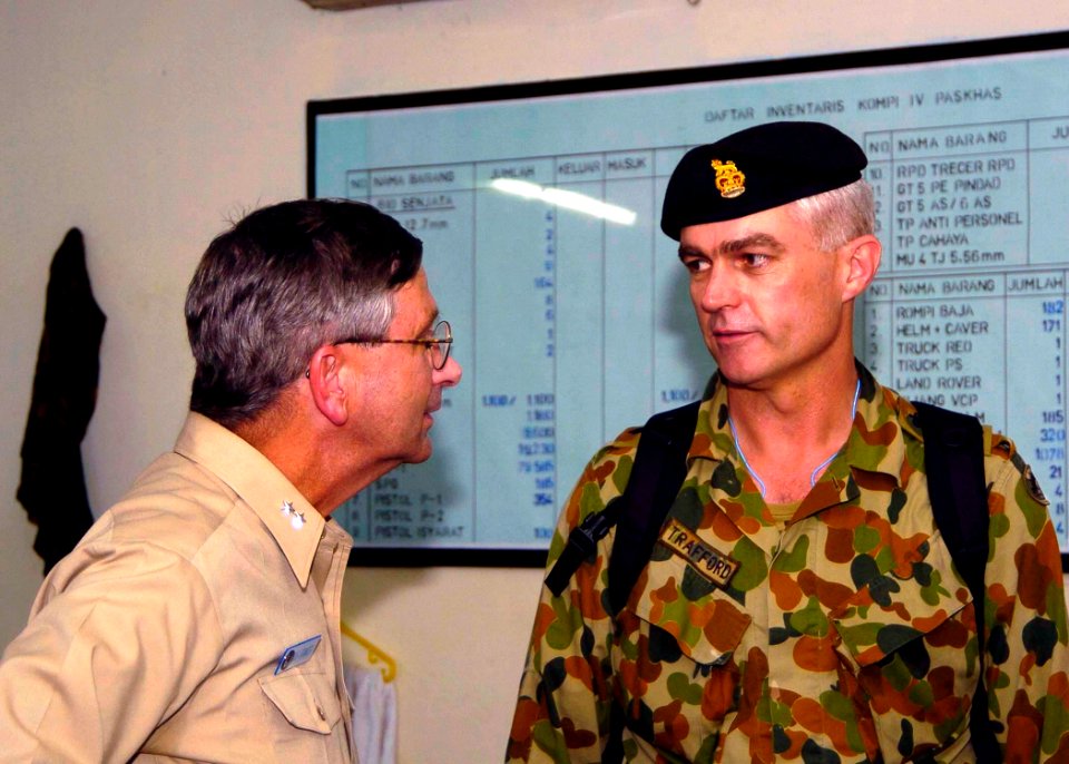 US Navy 050103-N-0057P-283 Commander, Carrier Strike Group Nine (CSG-9), Rear Adm. Doug Crowder, speaks with a member of the Australian Royal Army
