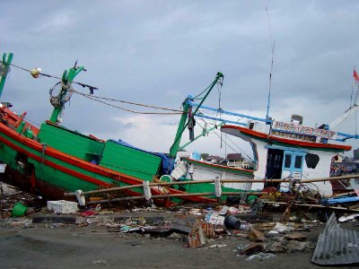 US Navy 050101-O-XXXXB-067 Boats washed ashore near local businesses in down town Aceh, Sumatra following a massive Tsunami that struck the area on the 26th of December 2004