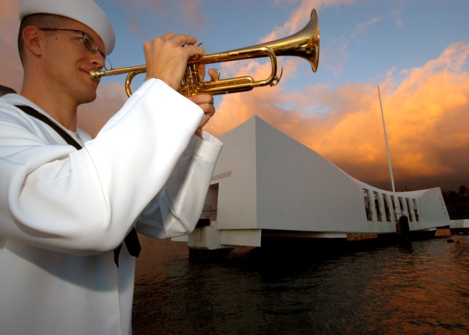 US Navy 041207-N-3019M-003 Musician 1st Class Guy Gregg, assigned to the Pacific Fleet Band, practices as the primary bugler before the 63rd commemoration of the Dec. 7, 1941 attack on Pearl Harbor, Hawaii