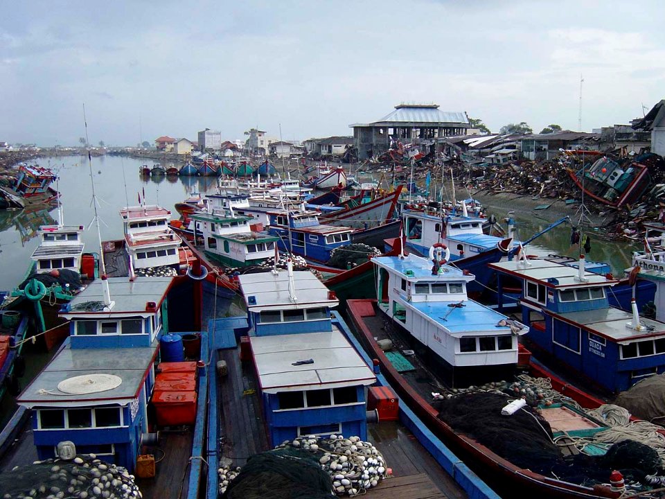 US Navy 050101-O-XXXXB-091 Boats were clustered and washed ashore near down town Aceh, Sumatra following a massive Tsunami that struck the area on the 26th of December 2004
