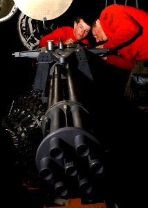 US Navy 041129-N-5345W-034 Aviation Ordnanceman Airman James Brady, left, and Aviation Ordnanceman 2nd Class Douglas Vanstrien perform routine maintenance on an M61A1 20mm Vulcan cannon