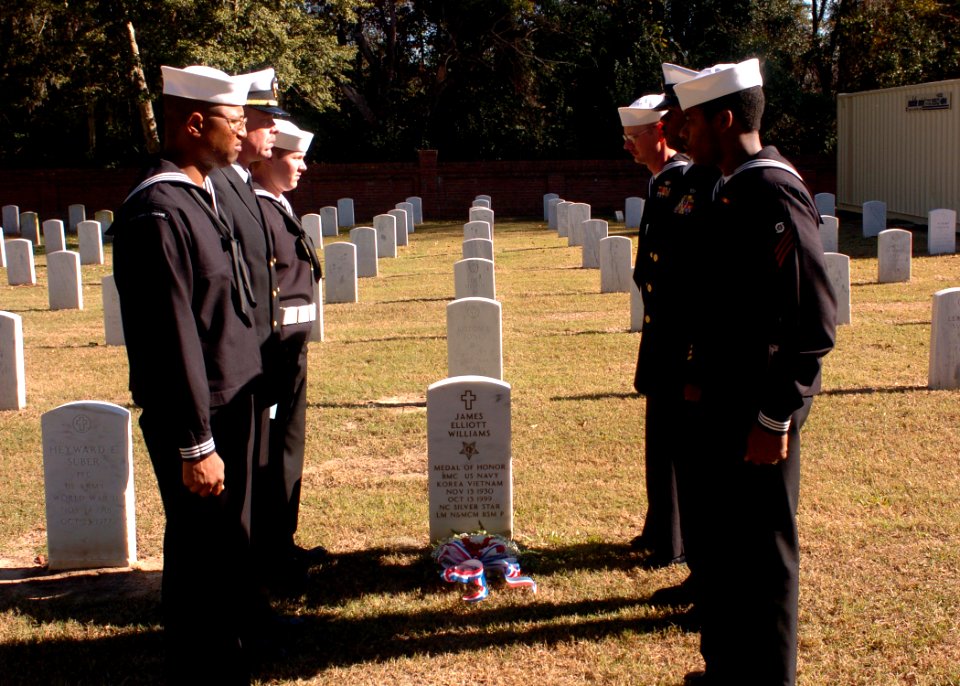 US Navy 041208-N-6332F-003 Sailors assigned to the guided missile destroyer Precommissioning Unit (PCU) James E. Williams (DDG 95), pay their respects during a memorial ceremony honoring Boatswain's Mate 1st Class James E. Will