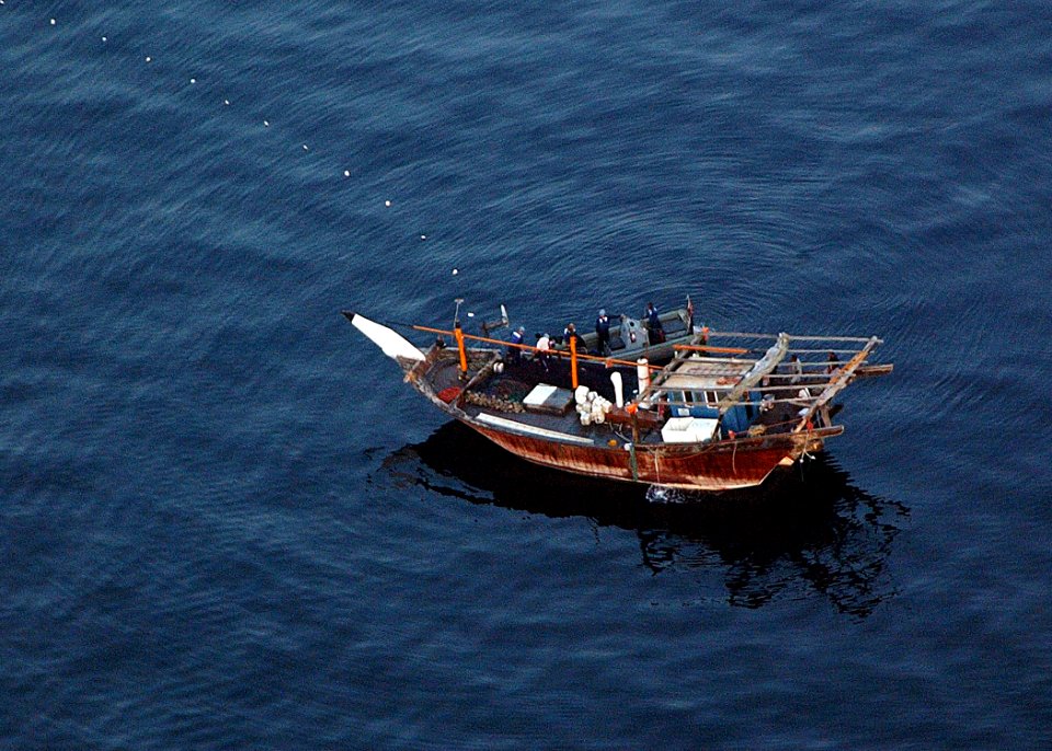 US Navy 041030-N-4374S-002 A Visit, Board, Search and Seizure (VBSS) team, assigned to the guided missile cruiser USS Vicksburg (CG 69), boards an Iranian dhow for a Maritime Interception Operation (MIO)