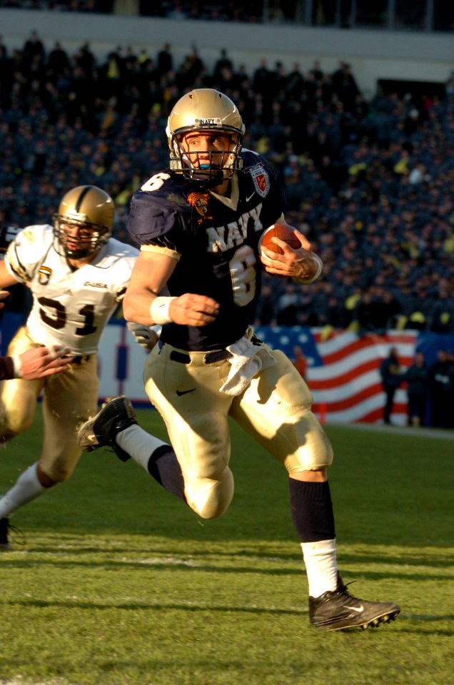 US Navy 041204-N-9693M-007 U.S. Naval Academy Quarterback Aaron Polanco, from Wimberley, Texas, rushes the goal line for the Navy's first touchdown during the second quarter of the 105th Army vs Navy game