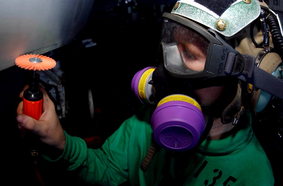 US Navy 041101-N-8158F-116 Aviation Electronics Technician 3rd Class Joshua Hockenberry, of Orlando, Fla., performs corrosion preventive procedures on an EA-6B Prowler