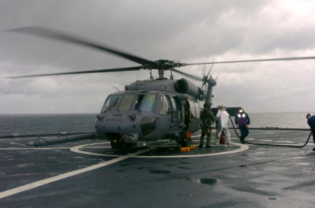 US Navy 041217-F-1740G-005 An Air Force HH-60 Pave Hawk helicopter aboard the amphibious dock landing ship USS Fort McHenry (LSD 43), receives fuel as it completes deck-landing qualification training
