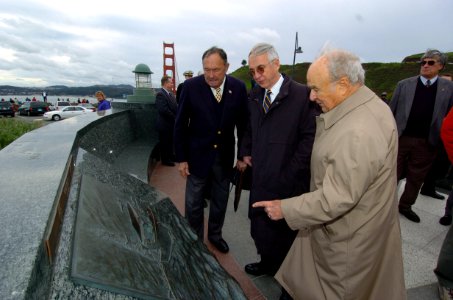 US Navy 041229-N-9693M-253 Secretary of the Navy (SECNAV), Gordon England, center, views the Navy plaque at the Lone Sailor Memorial