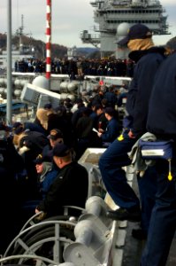 US Navy 050108-N-9389D-063 Crew members gather on the flight deck during an abandon-ship drill held aboard the conventionally powered aircraft carrier USS Kitty Hawk (CV 63) while in port Yokosuka, Japan