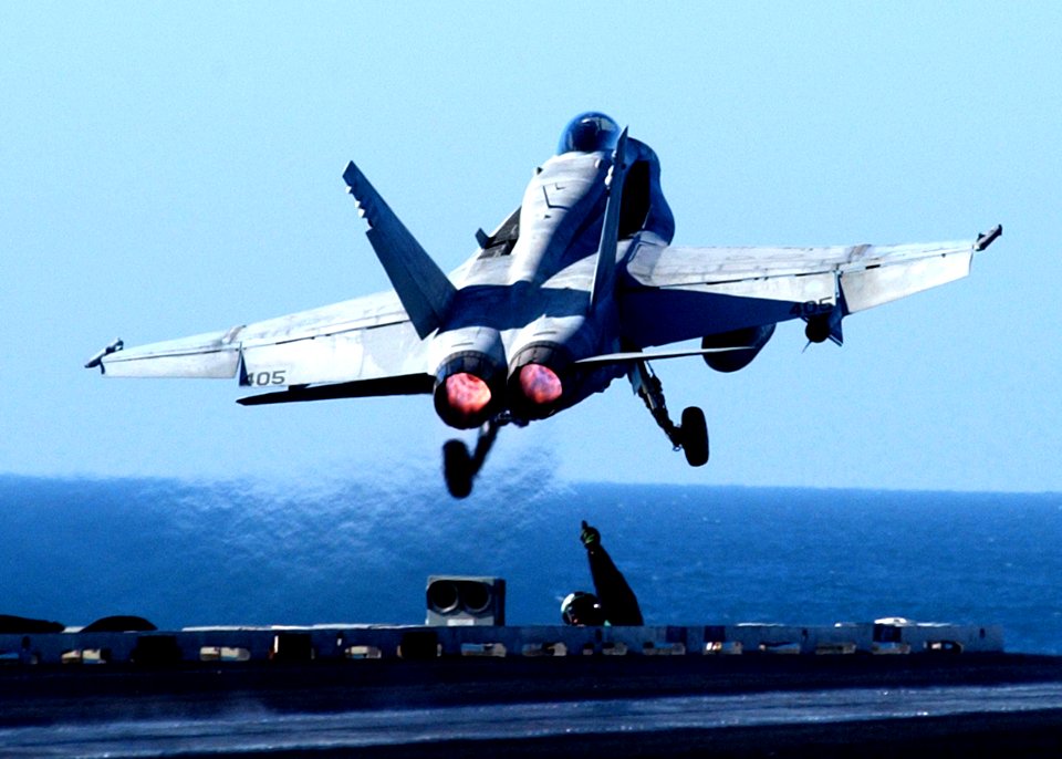 US Navy 041223-N-6363M-003 Aviation Boatswain's Mate Ronnie Mason gives a thumbs up sign after the successful launch of an F-A-18C Hornet