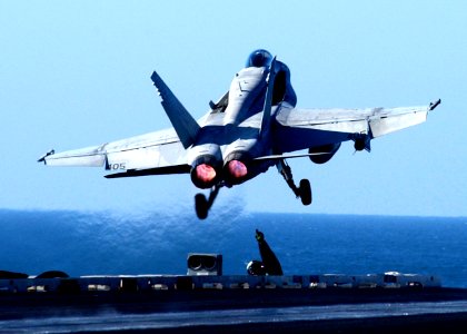 US Navy 041223-N-6363M-003 Aviation Boatswain's Mate Ronnie Mason gives a thumbs up sign after the successful launch of an F-A-18C Hornet