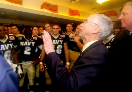 US Navy 041230-N-9693M-992 The Secretary of the Navy Gordon England congratulates the U.S. Naval Academy Midshipman football team on their victory over the Lobos of New Mexico at the Emerald Bowl in San Francisco