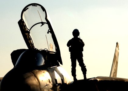 US Navy 050113-N-6363M-009 A pilot prepares to enter his F-14B Tomcat on the flight deck aboard USS Harry S. Truman (CVN 75)