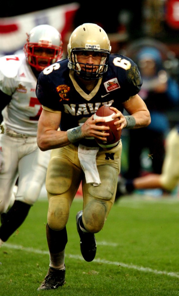 US Navy 041230-N-9693M-001 U.S. Naval Academy Midshipman 1st Class Aaron Polanco runs for a touchdown in the 1st quarter of play against the Lobos of New Mexico at the Emerald Bowl in San Francisco