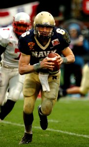 US Navy 041230-N-9693M-001 U.S. Naval Academy Midshipman 1st Class Aaron Polanco runs for a touchdown in the 1st quarter of play against the Lobos of New Mexico at the Emerald Bowl in San Francisco