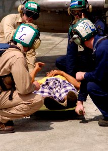 US Navy 050103-N-0057P-457 Sailors assigned to USS Abraham Lincoln (CVN 72) and Carrier Air Wing Two (CVW-2) prepare to transport a Tsunami victim