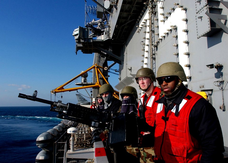 US Navy 041228-N-2984R-040 Sailors man an M240 machine gun during a General Quarters drill on the flight deck of USS Harry S. Truman (CVN 75)
