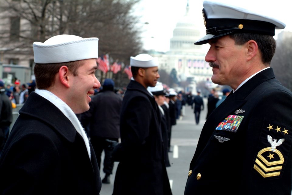US Navy 050120-N-0962S-040 Master Chief Petty Officer of the Navy (MCPON) Terry Scott visits with one of the hundreds of Sailors who helped line the street cordon down Pennsylvania Avenue for the Inauguration Day Parade
