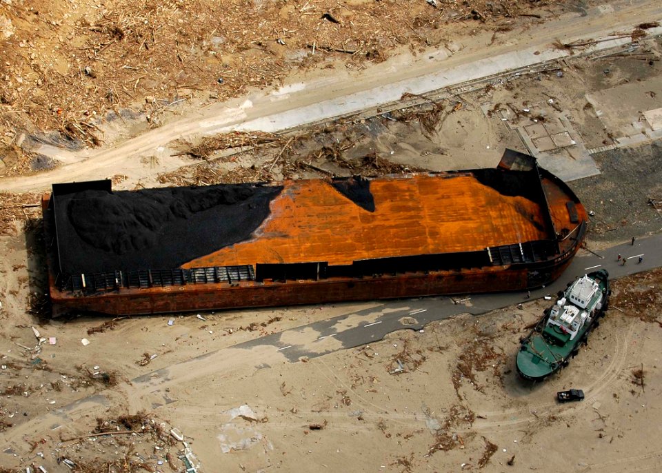 US Navy 050106-N-4166B-313 An aerial view of two ships that were washed ashore at the waterfront of an industrial area near Banda Aceh, Sumatra, Indonesia