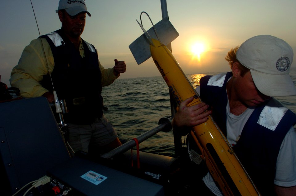 US Navy 050121-N-2653P-542 David Melhuish and Wade Fitts of the Navy Oceanographic Office International Survey Team, prepare to deploy a side-scan sonar device to bottom map the coastline near Banda Aceh on the island of Sumatr