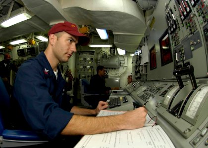 US Navy 050103-N-9079D-096 Gas Turbine System 1st Class Robert Whynot, of Westin, Mass., parallels the generator to maintain proper power in the Central Control Station aboard the guided missile destroyer USS Benfold (DDG 65)