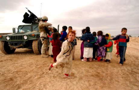 US Navy 050124-N-1810F-592 Seabees hand out cookies to local Iraqi children