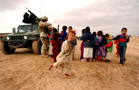 US Navy 050124-N-1810F-592 Seabees hand out cookies to local Iraqi children photo