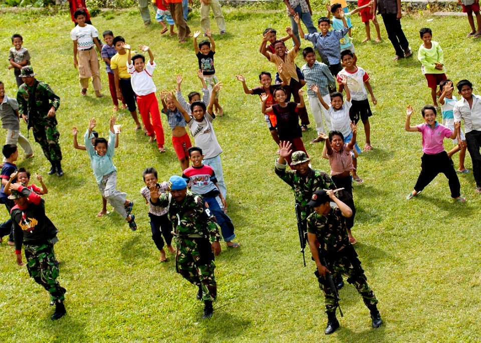 US Navy 050106-N-4166B-378 Children in Lamno, Sumatra, Indonesia are all smiles after receiving food and water flown-in by U.S. Navy and foreign military helicopters