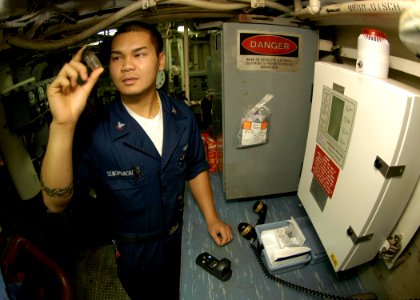 US Navy 050103-N-9079D-126 Engineman 3rd Class Steve Sengphachanh of Anderson, Calif., checks bromine levels on potable water