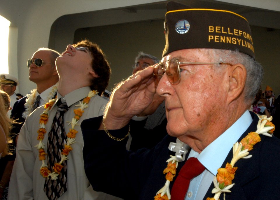 US Navy 041207-N-3019M-007 A Pearl Harbor survivor salutes during morning colors during the 63rd commemoration of the Dec. 7, 1941 attack on Pearl Harbor, Hawaii