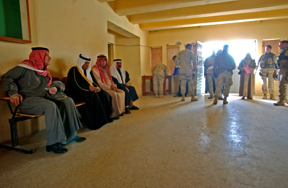 US Navy 050121-N-1810F-306 Potential poll workers for the upcoming Iraqi elections wait to apply for permits