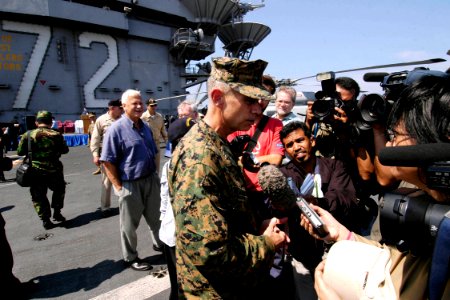 US Navy 050203-N-4166B-130 Commander Combined Support Forces Indonesia, Lt. Gen. Blackman, answers questions from the media, after speaking to sailors of USS Abraham Lincoln (CVN-72) and embarked Carrier Air Wing Two (CVW-2)