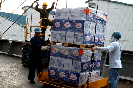 US Navy 050106-N-4205W-012 Crew members assigned to the combat stores ship USNS Concord (T-AFS 5) load more than 635 pallets of supplies