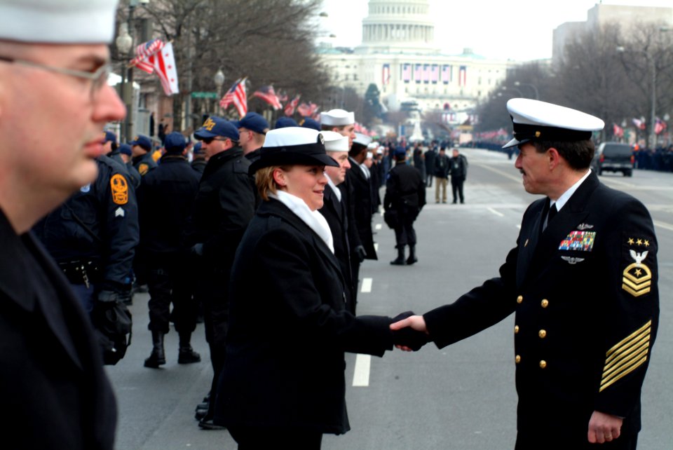 US Navy 050120-N-0962S-060 Master Chief Petty Officer of the Navy (MCPON) Terry Scott shakes hands with one of the hundreds of Sailors who helped line the street cordon down Pennsylvania Avenue for the Inauguration Day Parade