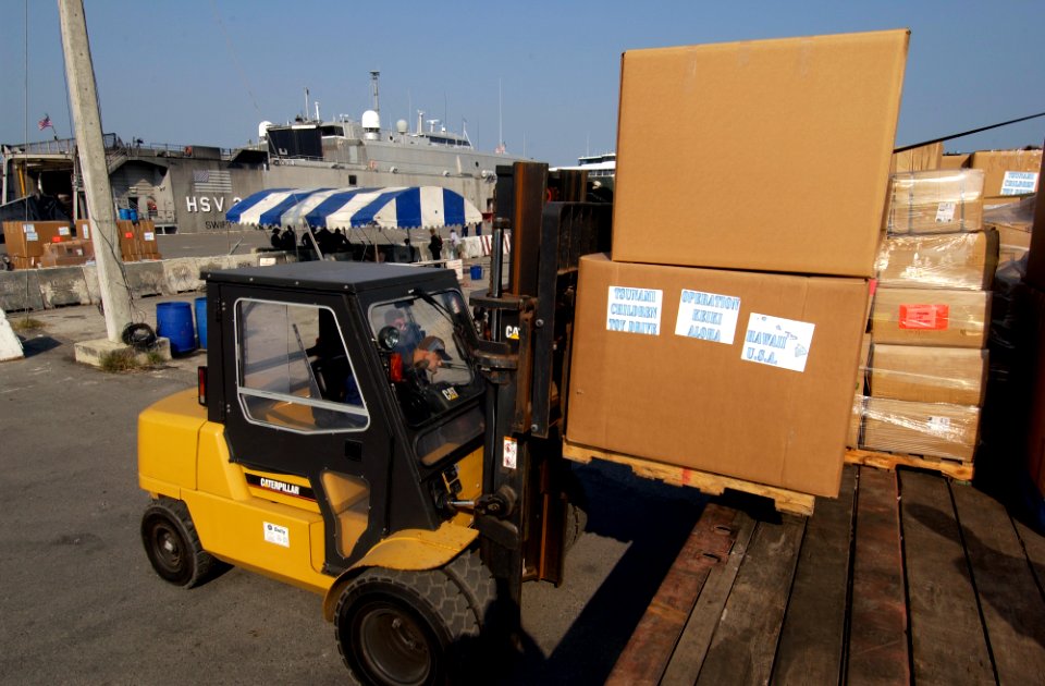 US Navy 050207-N-3642E-011 Toys donated from Military personnel stationed in Hawaii are offloaded from the High Speed Vessel Two (HSV-2) Swift prior to being handed-out to victims of the tsunami that hit Southeast Asia