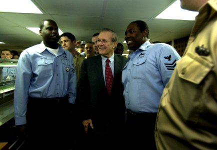 US Navy 050209-F-7203T-155 Secretary of Defense (SECDEF) Donald H. Rumsfeld stops to pose for photographs with Sailors aboard the Spruance-class destroyer USS O'Bannon (DD 987) in Nice, France