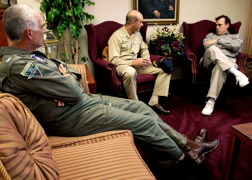 US Navy 050122-N-6074Y-036 U.S. Ambassador to Singapore, the Honorable Frank Lavin, right, and Commanding Officer, USS Abraham Lincoln (CVN-72), Capt. Kendal Card, middle, talk about the current situation in Banda Aceh, Indones