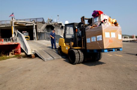 US Navy 050207-N-3642E-008 Toys donated from Military personnel stationed in Hawaii are offloaded from the High Speed Vessel Two (HSV-2) Swift prior to being handed-out to victims of the tsunami that hit Southeast Asia