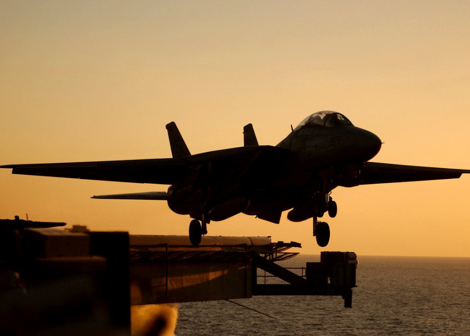 US Navy 050124-N-6363M-009 An F-14B Tomcat assigned to the Swordsmen of Fighter Squadron Three Two (VF-32), launches from the flight deck of the Nimitz-class aircraft carrier USS Harry S. Truman (CVN 75)