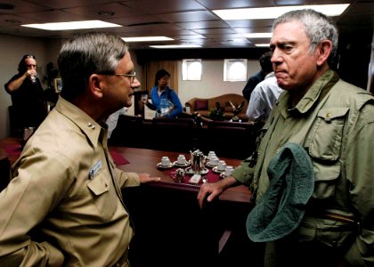 US Navy 050102-N-4166B-078 Commander Carrier Strike Group Nine (CSG-9), Rear Adm. Doug Crowder, greets CBS News Anchorman Dan Rather onboard USS Abraham Lincoln (CVN-72)