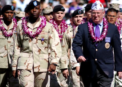 US Navy 050213-N-3019M-005 Active duty and retired Purple Heart recipients march onto the field prior to the kickoff of the 2005 NFL Pro Bowl, held in Honolulu, Hawaii