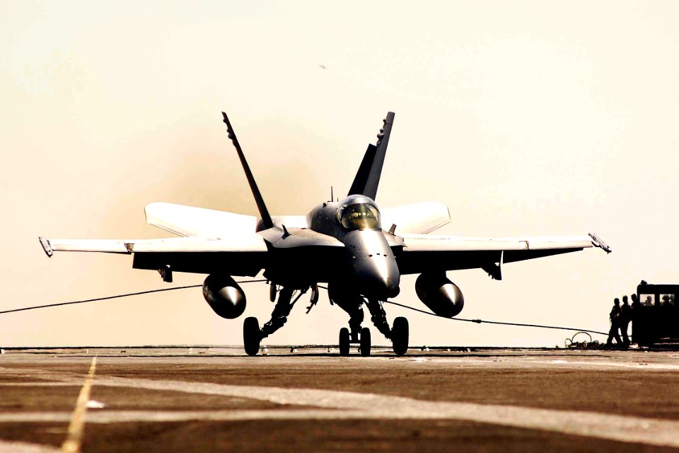 US Navy 050129-N-6074Y-080 An F-A-18C assigned to Vigilantes of Strike Fighter Squadron One Five One (VFA-151), makes an arrested landing on the flight deck of the Nimitz-class aircraft carrier USS Abraham Lincoln (CVN-72