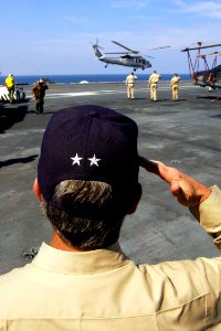 US Navy 050203-N-6074Y-107 Commander Carrier Strike Group Nine (CSG-9), Rear Adm. Doug Crowder, foreground, salute the departing U.S. Ambassador to Indonesia, the Honorable Lynn Pascoe and Lt. Gen. Blackman, as they depart USS