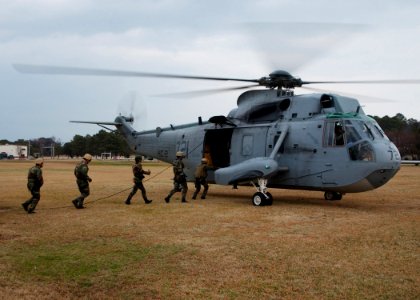 US Navy 050216-N-4374S-004 Sailors assigned to Explosive Ordnance Disposal Mobile Unit Two (EODMU-2), board a UH-3H Sea King helicopter
