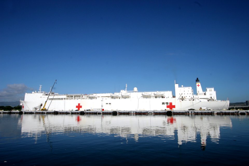 US Navy 050112-N-3228G-003 Donated medical supplies, coordinated by the National Guard, are craned aboard the Military Sealift Command (MSC) hospital ship USNS Mercy (T-AH 19) during a brief port visit to Pearl Harbor, Hawaii