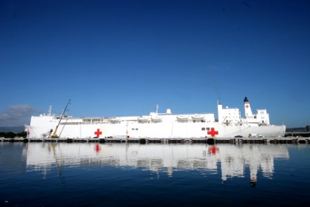 US Navy 050112-N-3228G-003 Donated medical supplies, coordinated by the National Guard, are craned aboard the Military Sealift Command (MSC) hospital ship USNS Mercy (T-AH 19) during a brief port visit to Pearl Harbor, Hawaii