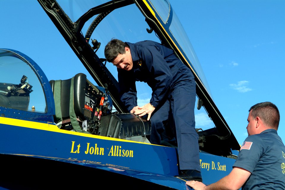 US Navy 050203-N-0962S-170 Master Chief Petty Officer of the Navy (MCPON) Terry Scott climbs from the back seat after taking a flight in an F-A-18D Hornet while visiting the Blue Angels' winter training facility on board Naval